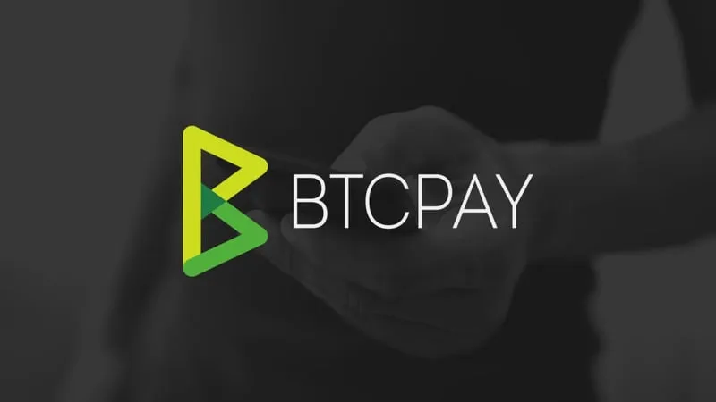 A laptop displaying payment processing software, representing merchant crypto payment infrastructure