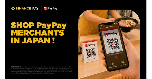 Visitor paying at a Japanese shop by scanning a QR code with a crypto payment app